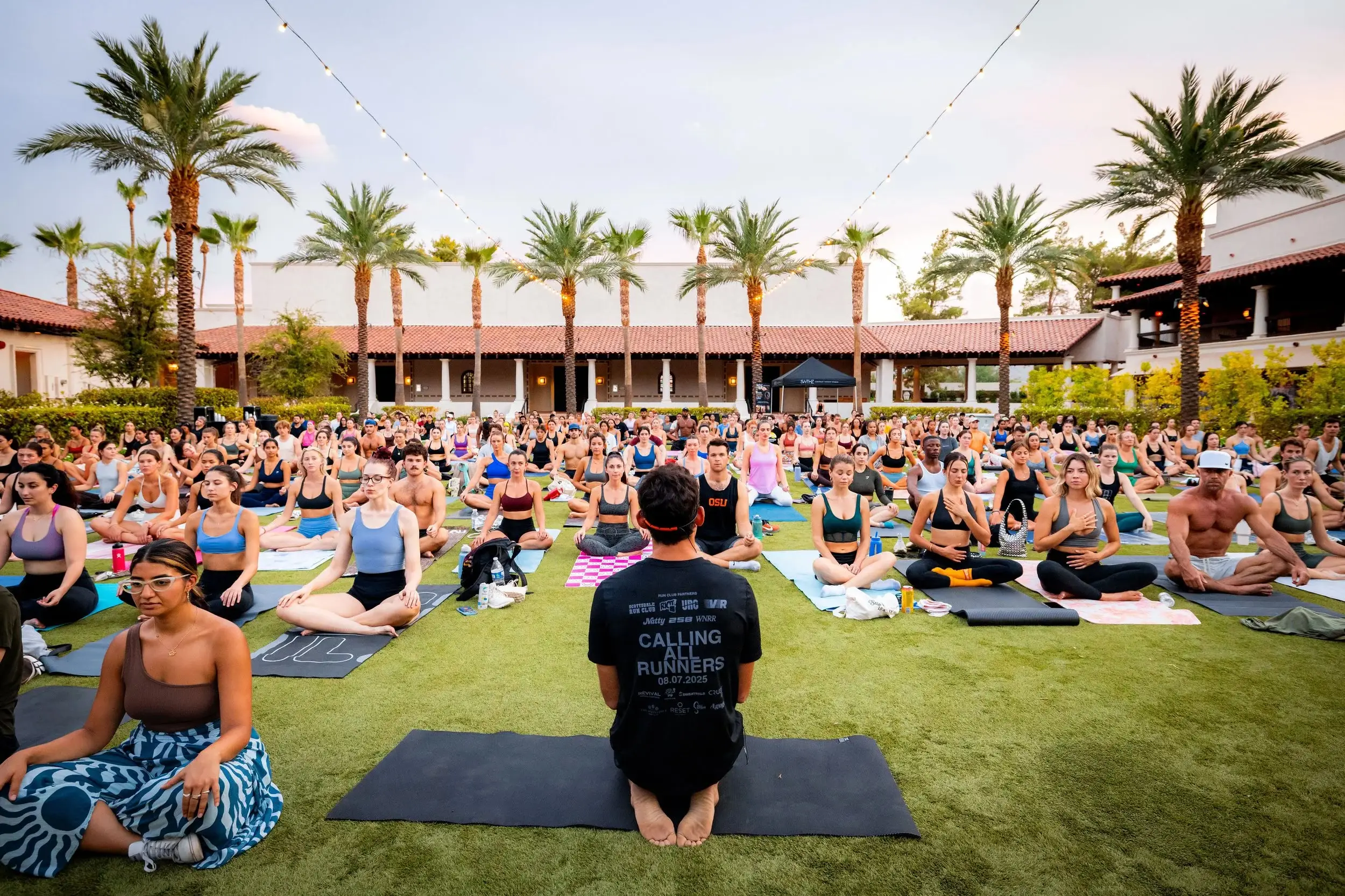 Outdoor wellness class on the grass after the race